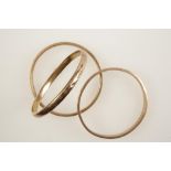 THREE 9CT ROSE GOLD BANGLES