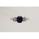 A SAPPHIRE AND DIAMOND THREE STONE DRESS RING