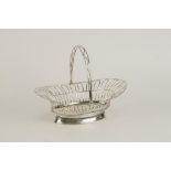 A GEORGE III SWING HANDLED CAKE BASKET