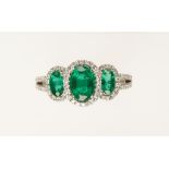 AN EMERALD AND DIAMOND DRESS RING