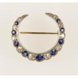A SAPPHIRE AND DIAMOND CRESCENT BROOCH