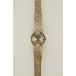 TISSOT: A LADIES 9CT YELLOW GOLD WRISTWATCH