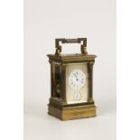 A FRENCH BRASS CASED REPEATING CARRIAGE CLOCK