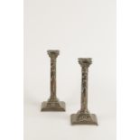 A PAIR OF CANDLESTICKS of Corinthian form