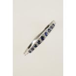 A SAPPHIRE AND DIAMOND BANGLE