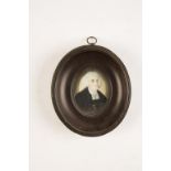 AN OVAL PAINTED PORTRAIT MINIATURE, 19th century, of a Wesleyan Preacher