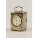 A FRENCH HAMMERED SILVER CARRIAGE CLOCK