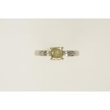 A YELLOW DIAMOND AND PLATINUM DRESS RING