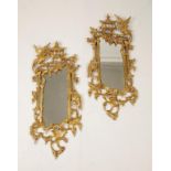 A PAIR OF ROCOCO STYLE GILTWOOD MIRRORS