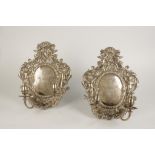 A PAIR OF CONTINENTAL BAROQUE STYLE TWO LIGHT WALL SCONCES