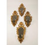 A SET OF FOUR CONTINENTAL GILTWOOD MIRROR MOUNTED GIRANDOLE