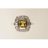 A YELLOW SAPPHIRE AND DIAMOND CLUSTER RING