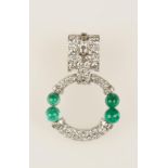 A DIAMOND AND EMERALD BROOCH