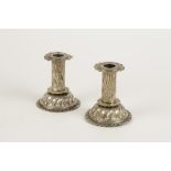 A PAIR OF VICTORIAN CANDLESTICKS