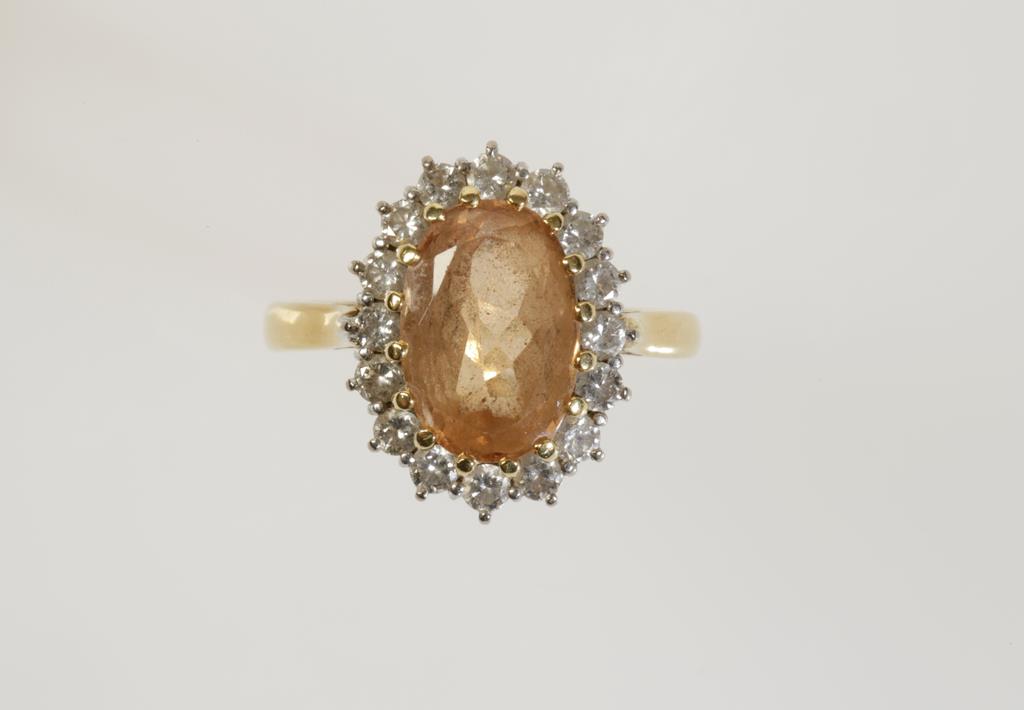 A GEMSTONE AND DIAMOND DRESS RING