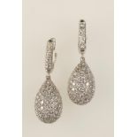 A PAIR OF DIAMOND ENCRUSTED EARRINGS