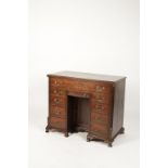 A GEORGE III MAHOGANY KNEEHOLE DESK