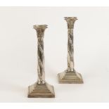 A PAIR OF EDWARDIAN CANDLESTICKS