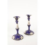 A PAIR OF ENAMEL CANDLESTICKS