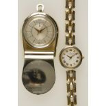 JAEGER-LECOULTRE: A LADIES WHITE METAL PURSE WATCH