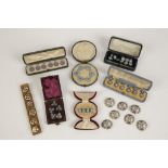A COLLECTION OF CASED BUTTONS AND DRESS STUDS