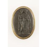 A WEDGWOOD BASALT CAMEO BROOCH