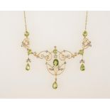 AN EDWARDIAN PERIDOT AND DIAMOND PENDANT