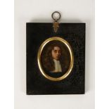 AN OVAL PAINTED PAINTED MINIATURE PORTRAIT ON COPPER OF A GENTLEMAN