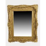 A LARGE RECTANGULAR BEVEL EDGED MIRROR