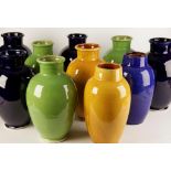 A COLLECTION OF TEN BRIGHTLY GLAZED POTTERY VASES of ovoid form with s
