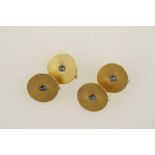 A SET OF FOUR YELLOW GOLD DRESS CLIPS