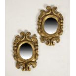 A PAIR OF CONTINENTAL BAROQUE STYLE GILTWOOD WALL MIRRORS