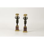 A PAIR OF EARLY 19TH CENTURY FRENCH BRONZE AND ORMOLU CANDLESTICKS