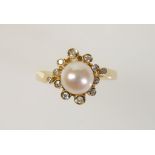A CULTURED PEARL AND DIAMOND DRESS RING