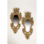 A PAIR OF WALL MIRRORS WITH SHAPED PLATES