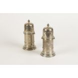 A PAIR OF VICTORIAN LIGHTHOUSE SUGAR CASTORS