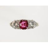 A RUBY AND DIAMOND THREE STONE DRESS RING