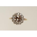 AN EDWARDIAN DIAMOND CLUSTER RING