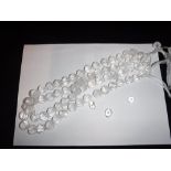 A LENGTH OF MELON-SHAPED CRYSTAL QUARTZ BEADS