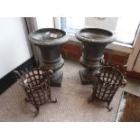 A PAIR OF CAST IRON GARDEN URNS 12.5" high and two similar stands