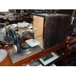 A 19TH CENTURY WILLCOX & GIBBS SEWING MACHINE with pine case