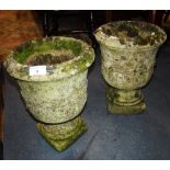 A PAIR OF RE-CONSTITUTED STONE GARDEN URNS 12.5" high