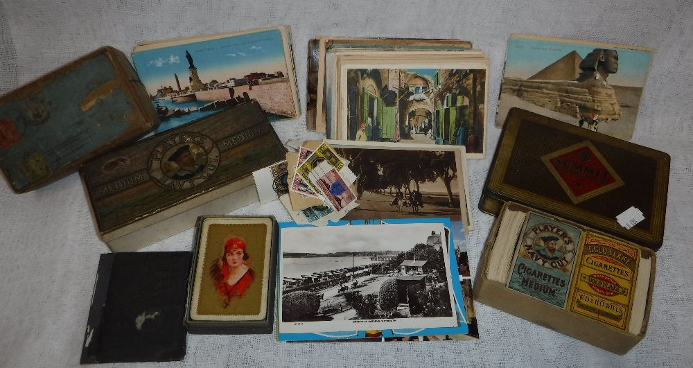 A SMALL COLLECTION OF CIGARETTE CARDS, postcards and other ephemera