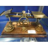 A SET OF POSTAL SCALES with stacking weights