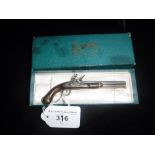 A NOVELTY LIGHTER IN THE FORM OF A 'MINIATURE FLINTLOCK GUN' stamped 'Harpers Ferry, 1907'