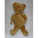 A 1950'S PLUSH TEDDY BEAR apparently purchased in Germany