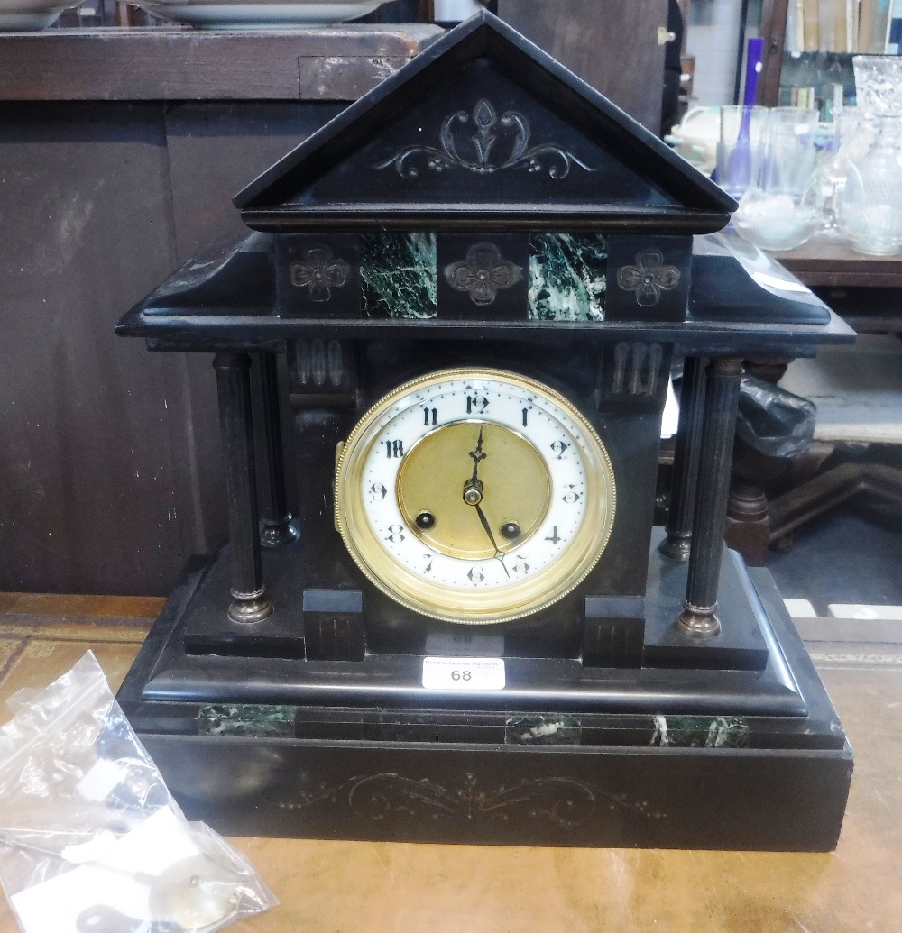 A 19TH CENTURY SLATE CASED MANTEL CLOCK of architectural design (key and pendulum in office)