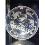 A CHINESE BLUE AND WHITE CHARGER, decorated with warriors, Qing, 16''dia.