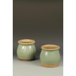 A PAIR OF LONGQUAN STYLE GREEN-GLAZED RIBBED JARS, probably 19th century, 8" high (2)
