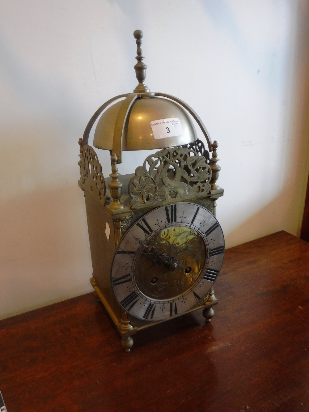 A REPRODUCTION BRASS CASE LANTERN CLOCK 16" high (including finial)